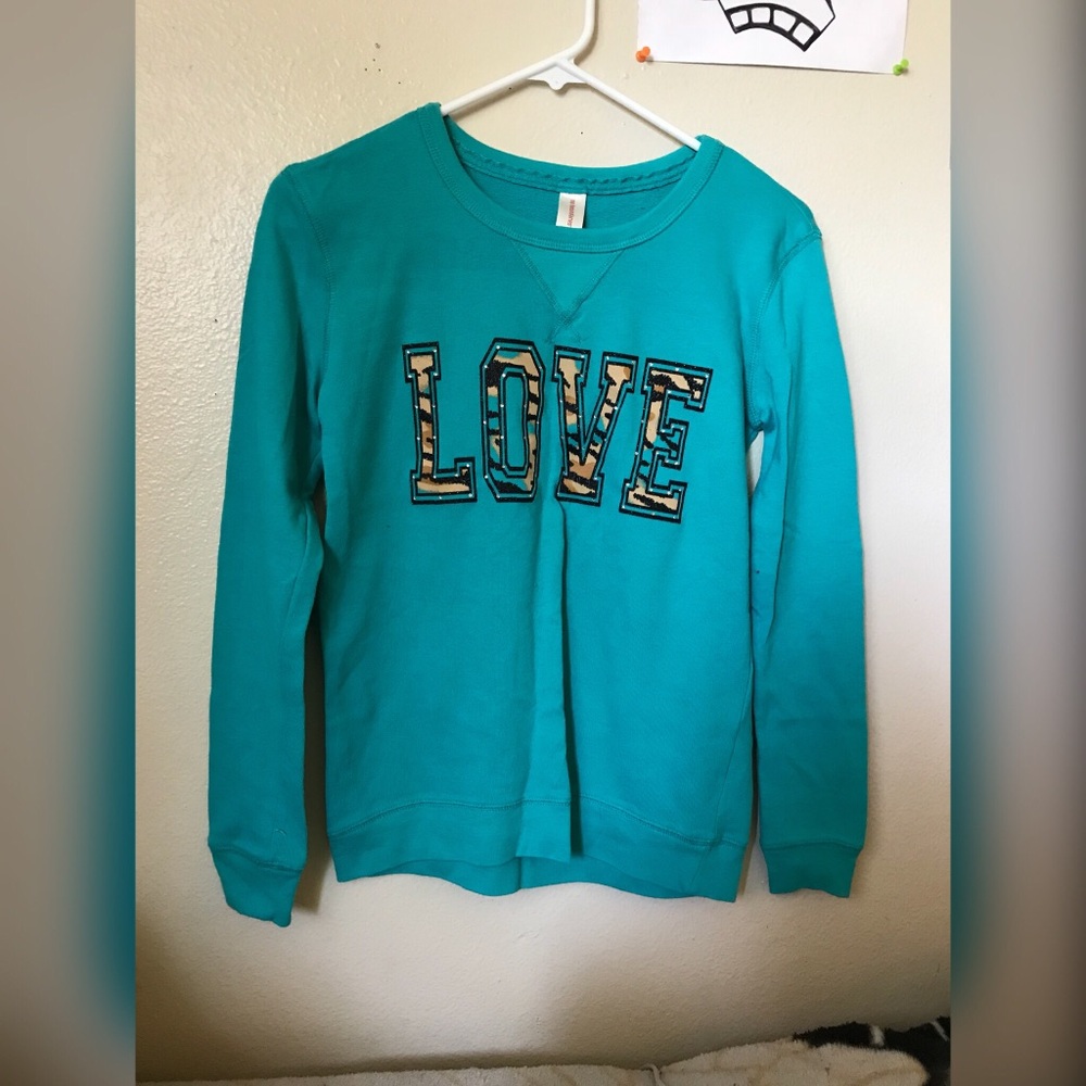 Blue sweater with “love” on it. (Worn once)